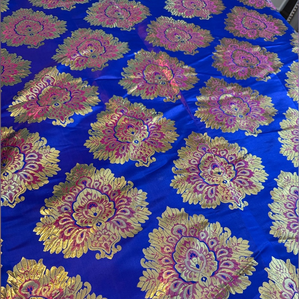 NEW. Gorgeous royal blue brocade fabric with golden metallic threads.